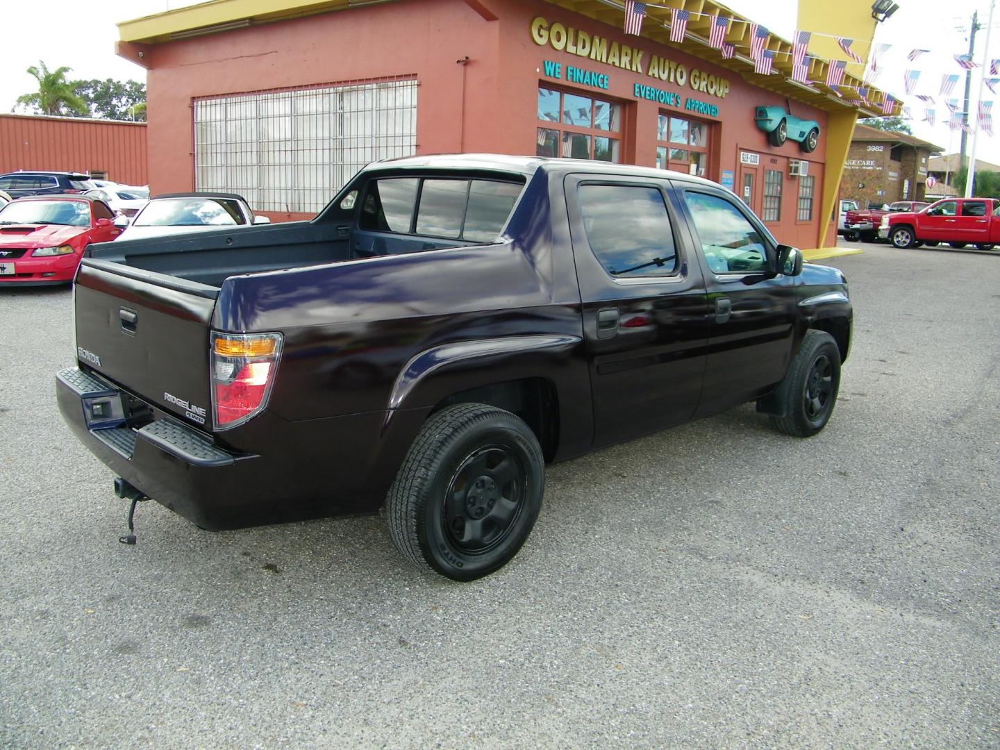 2007 Maroon /Grey Honda Ridgeline RT (2HJYK16267H) with an 3.5L V6 SOHC 24V engine, 5-Speed Automatic Overdrive transmission, located at 4000 Bee Ridge Road, Sarasota, FL, 34233, (941) 926-0300, 27.298664, -82.489151 - Photo#5